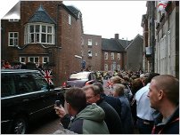 picture of people watching queen drive past