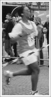 picture of wendy sprinting at end of 1/2 marathon 2005
